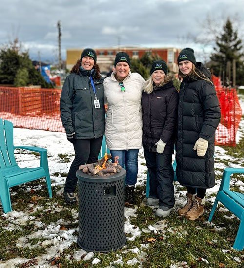 Photo of staff at fire pit popup