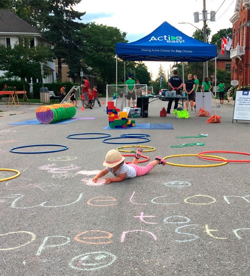 Kids and groups outdoors at an open streets event